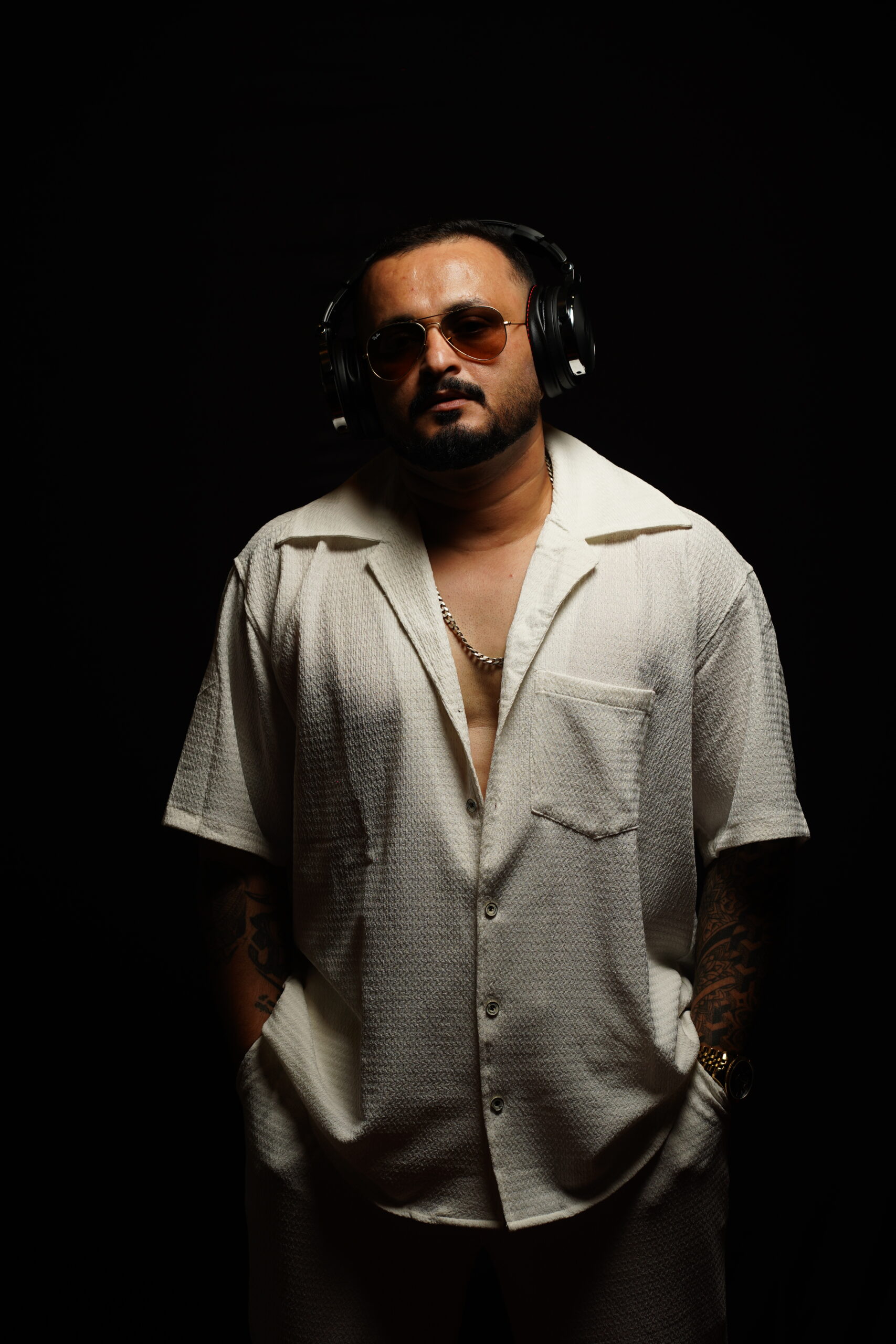 Side profile view of DJ focused on the mix